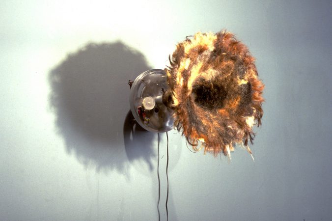 DIGITAL SCAT (15" x 12" x 15") - Randomly samples conversations and scats them back. This sculpture is covered in human hair, uses three sound sampling chips and a timer.